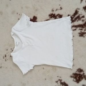 A white T-shirt with buttons